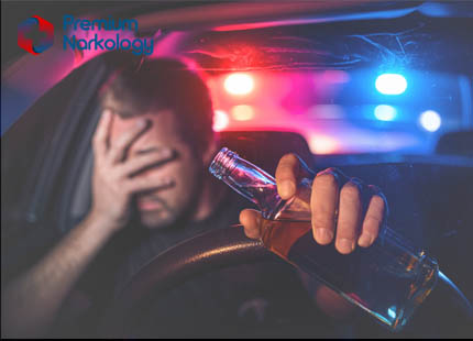 Последствия алкоголизма для общества и экономики Мужчина с бутылкой пива за рулём
